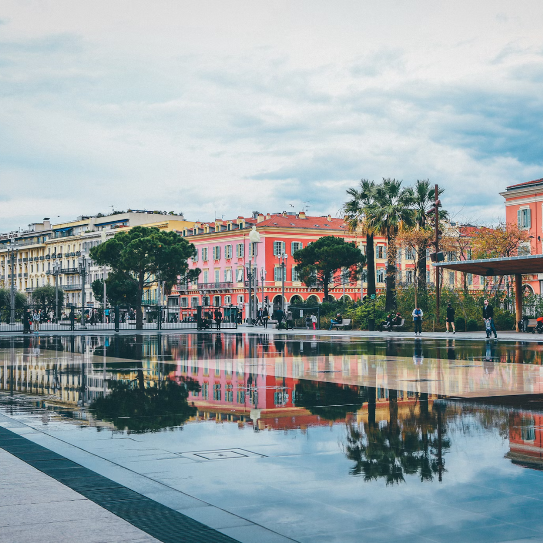 An image of Place Massena, the city's square full of colourful buildings.